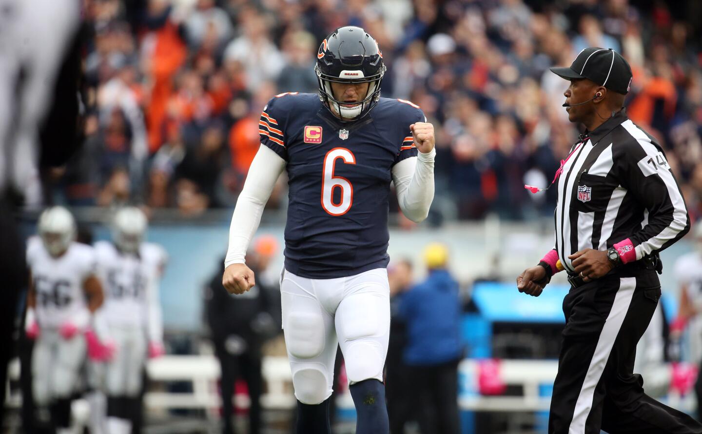 Jay Cutler celebrates his touchdown pass in the first quarter against the Raiders.