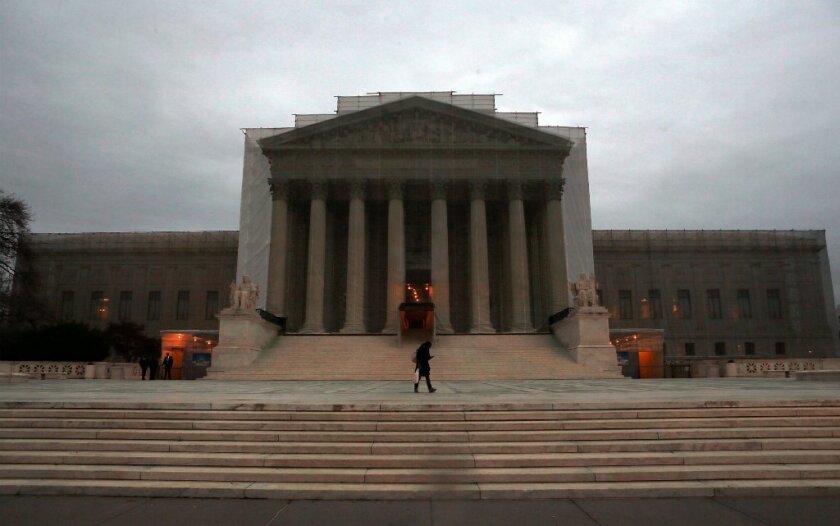 The U.S. Supreme Court, seen here with a realistic-looking drape as restoration work is underway, hears arguments on California's Proposition 8 and the Defense of Marriage Act at the end of March.