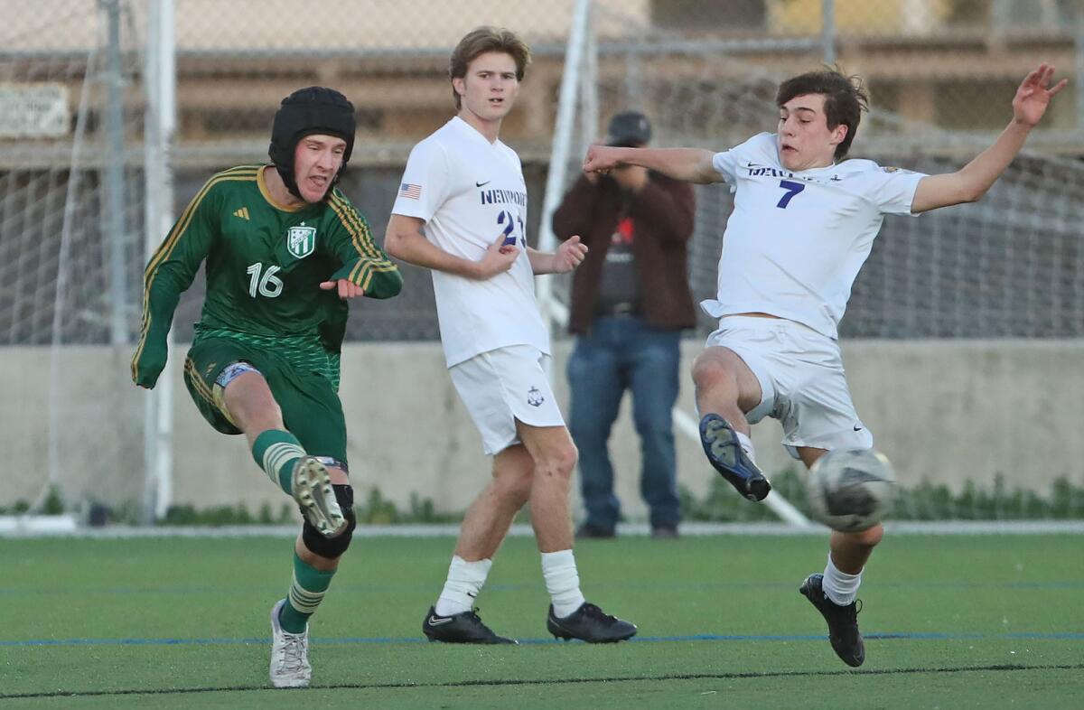 Edison's Nathan Jackson (16) kicks in a goal from outside the box past Newport Harbor's Landon Baker (7) on Monday.