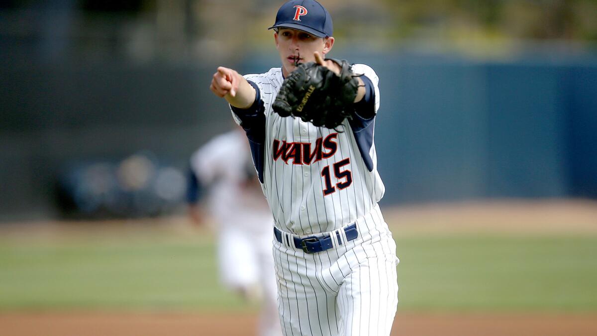 Pepperdine ace A.J. Puckett celebrates after retiring BYU in order in the first inning Thursday.