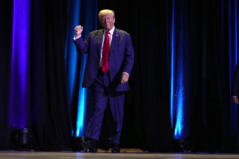 Republican presidential nominee former President Donald Trump walks on stage to speak at the National Guard Association of the United States' 146th General Conference, Monday, Aug. 26, 2024, in Detroit. (AP Photo/Carolyn Kaster)