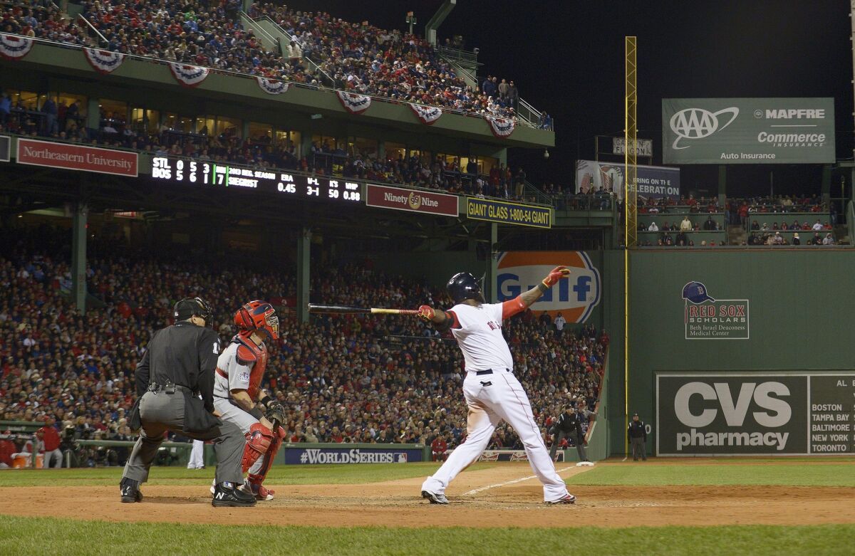 The Boston Red Sox's David Ortiz hits a two-run home run against the St. Louis Cardinals in the bottom of the seventh inning.