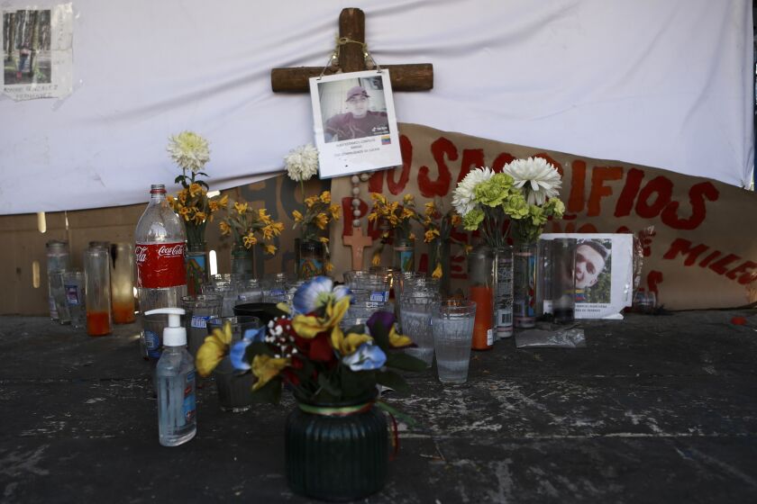 FILE - A makeshift altar in honor of migrants who died in a dormitory fire at an immigration detention center that killed more than three dozen people, in Ciudad Juarez, Mexico, April 20, 2023. Mexico prosecutor's office said, Thursday, June 8, 2023, in a statement, that a federal judge has charged another Venezuelan migrant for his alleged role in the March blaze at the detention center. (AP Photo/Christian Chavez, File)