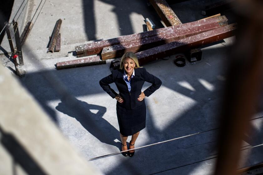 COSTA MESA, CA - MAY 13, 2021: New director Heidi Zuckerman stands amidst building materials at the construction site of the Orange County Museum of Art on May 13, 2021 in Costa Mesa, California.(Gina Ferazzi / Los Angeles Times)
