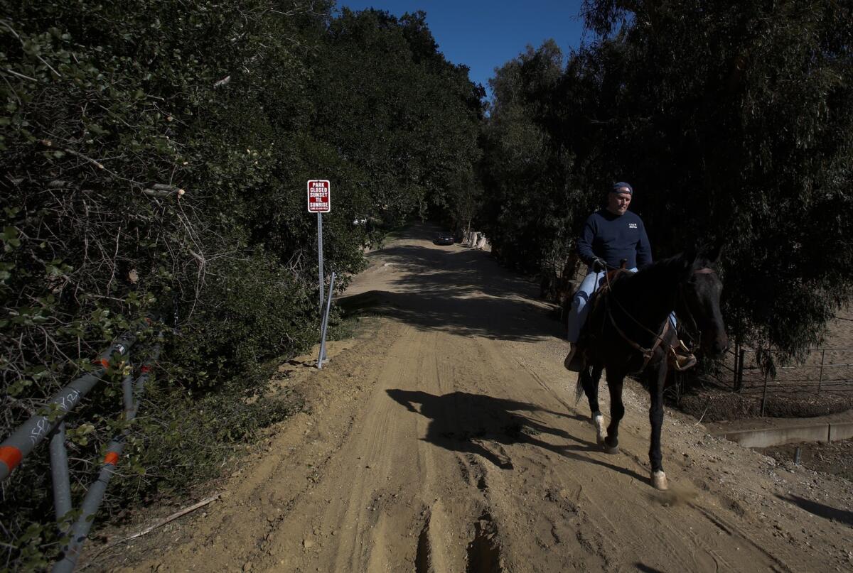 The entrance to the park is off Topanga Canyon Boulevard, starting at this steel gate uphill from horse stables.