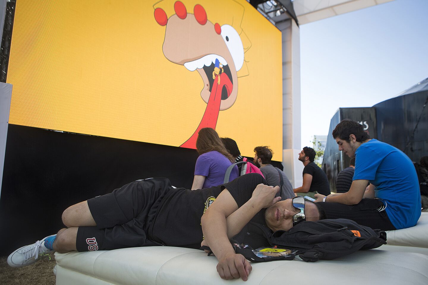 Steven Wong, 38, of Los Angeles rests during the first day of Comic-Con 2016.