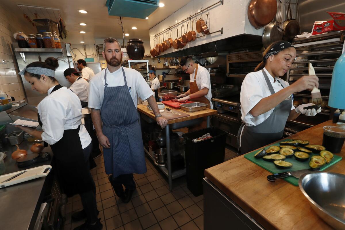 Chef Kevin Meehan inside the kitchen of his restaurant, Kali.