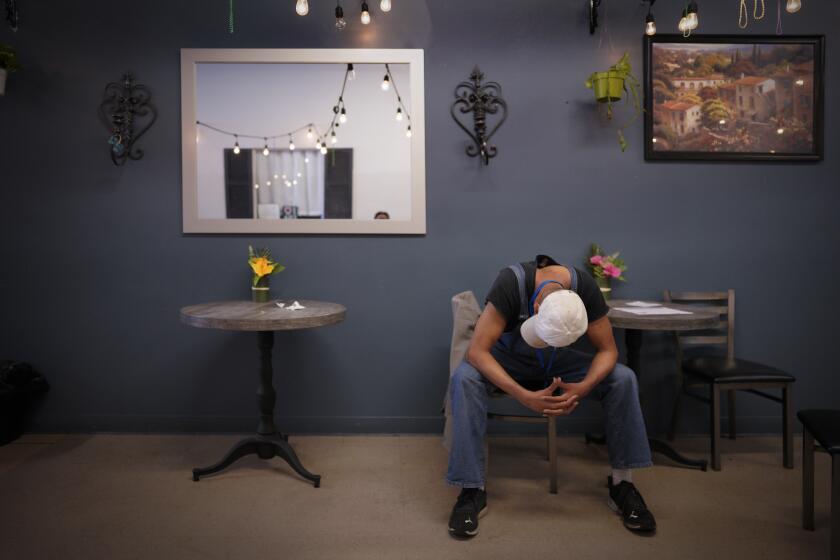 San Diego, CA - April 25: A the C2C Clubhouse on Monday, April 25, 2022 in San Diego, CA., Ketema Ross takes time to rest, while waiting for lunch to be served. (Nelvin C. Cepeda / The San Diego Union-Tribune)
