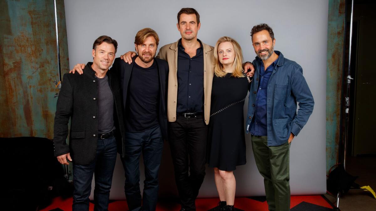 Director Ruben Ostlund, second from left, with the cast of "The Square" at the Toronto International Film Festival in September.
