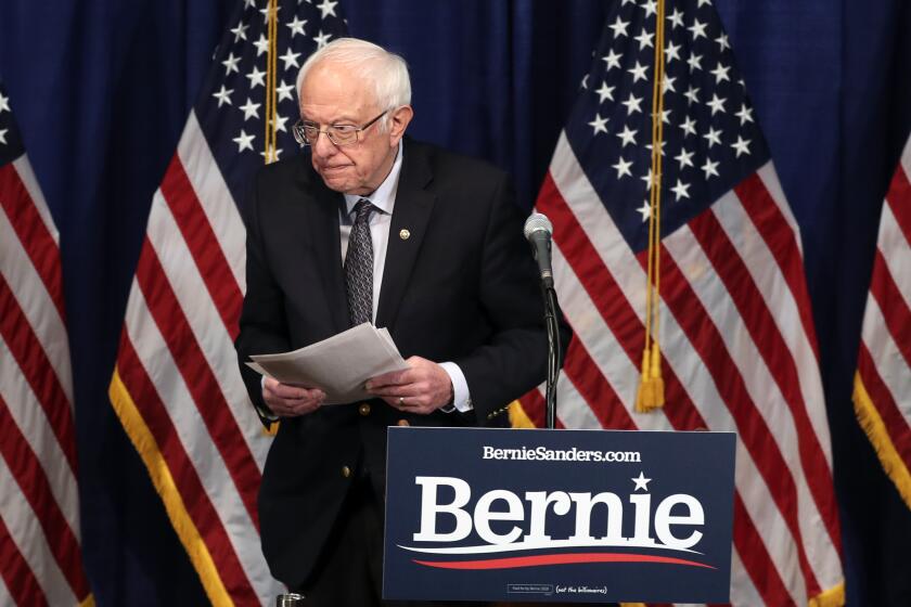 Democratic presidential candidate, Sen. Bernie Sanders, I-Vt., walks from the podium after speaking to reporters on Wednesday, March 11, 2020, in Burlington, Vt. (AP Photo/Charles Krupa)
