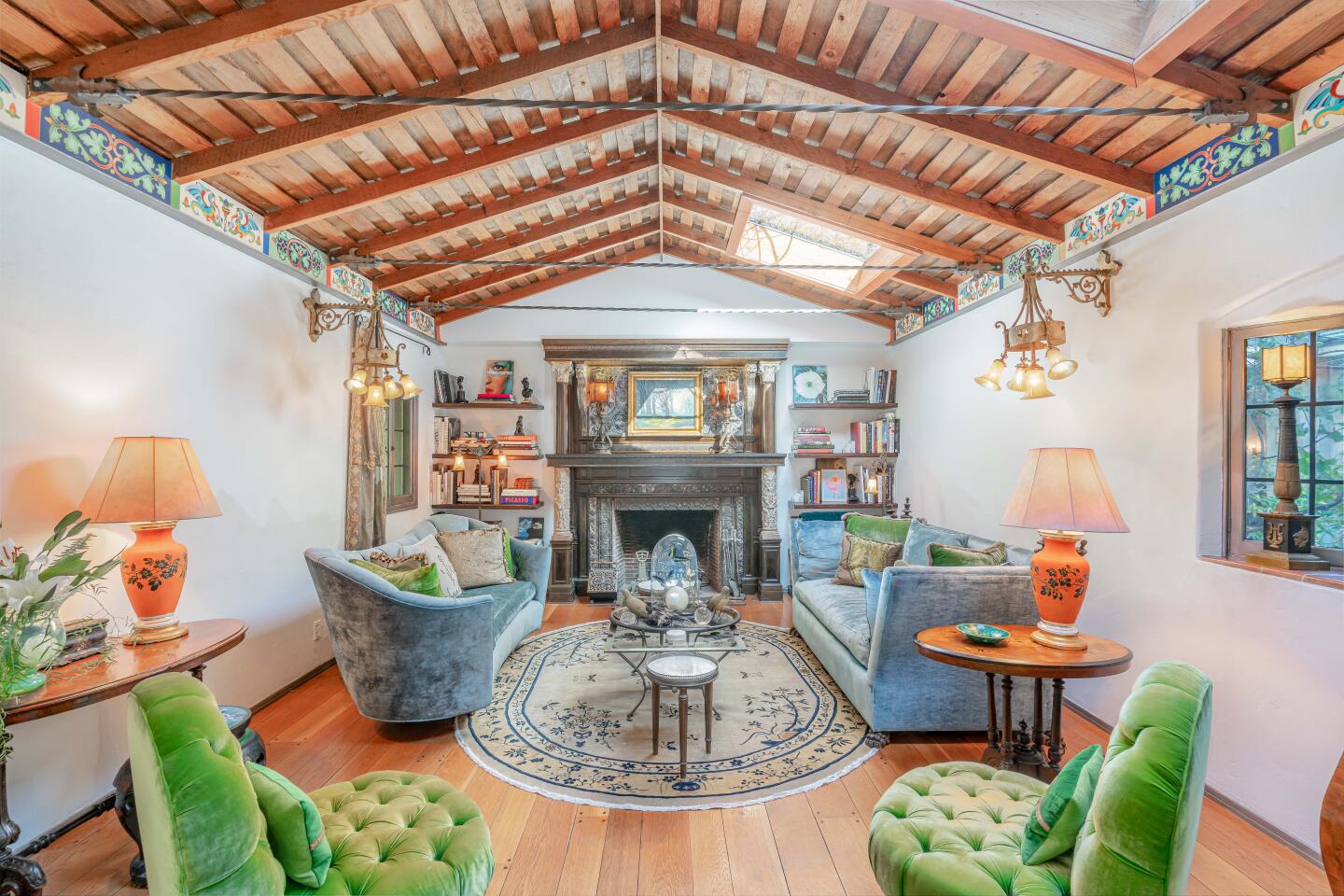 An ornate fireplace and vaulted ceilings are among features in the great room.