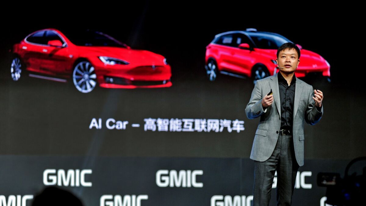 He Xiaopeng, chairman of XPENG Motors, speaks at a 2018 conference in Beijing.