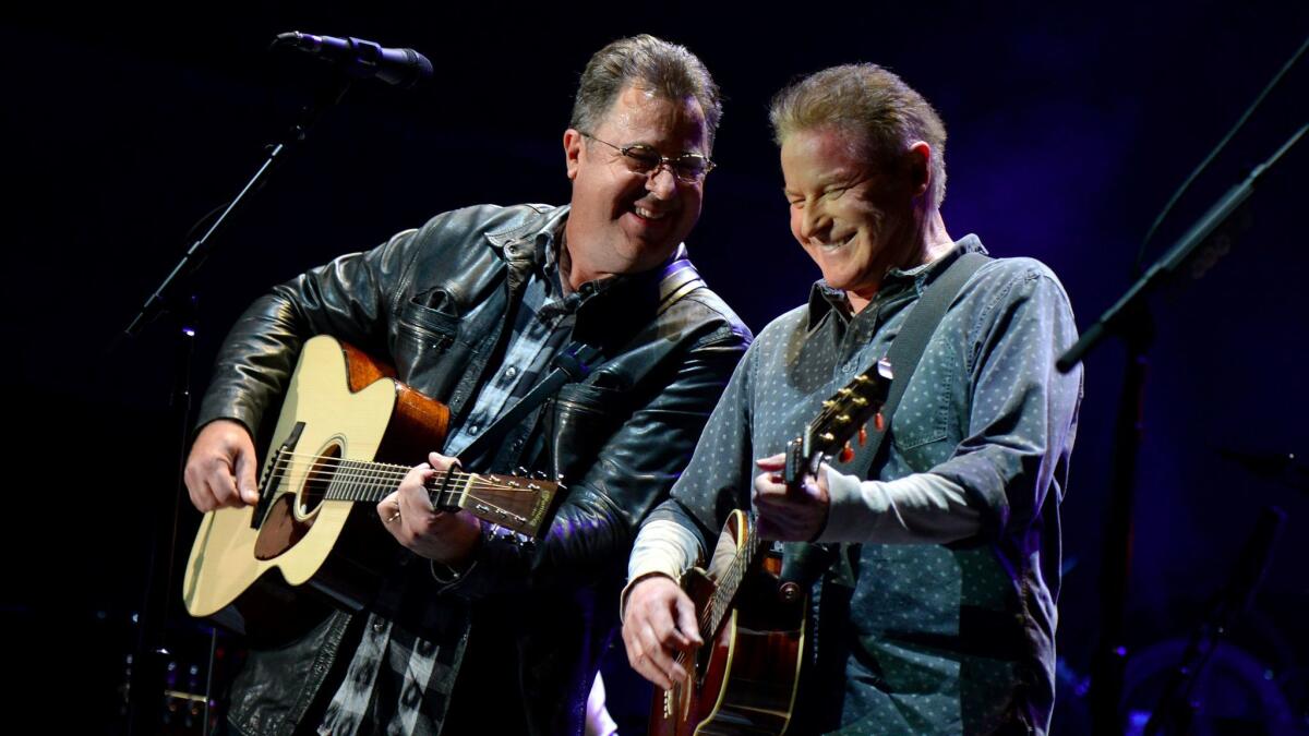 Vince Gill, left, joined Don Henley and the rest of the Eagles for Saturday's show.