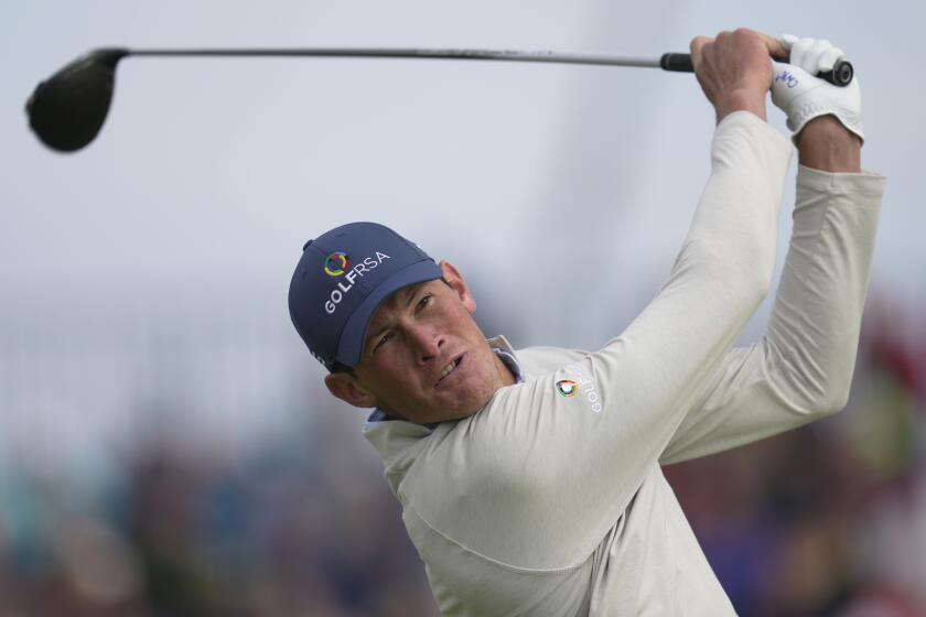 South Africa's Christo Lamprecht (amateur) plays a shot from the 4th tee on the first day of the British Open.