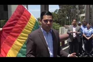 Long Beach Mayor Robert Garcia raises pride flag over civic plaza
