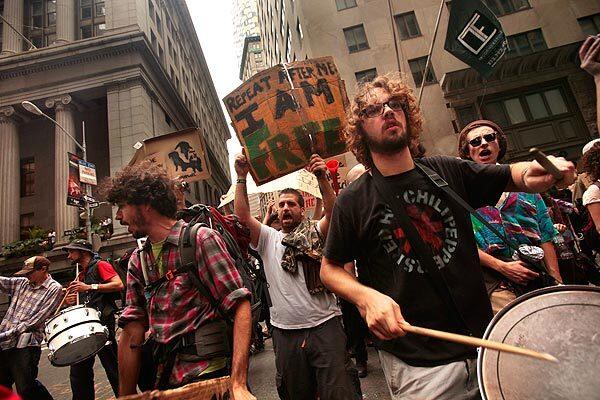 Occupy Wall Street began Day 13 with a march through the streets of Lower Manhattan around the time the opening bell rings at the stock exchange.
