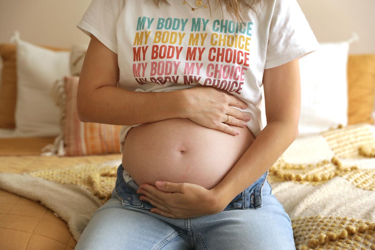 Chelsea Maras, 22 weeks pregnant, at home in Huntington Beach.
