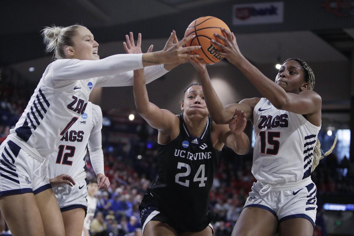 Gonzaga guard Esther Little, left, and forward Yvonne Ejim, right, battle UC Irvine forward Nevaeh Dean.