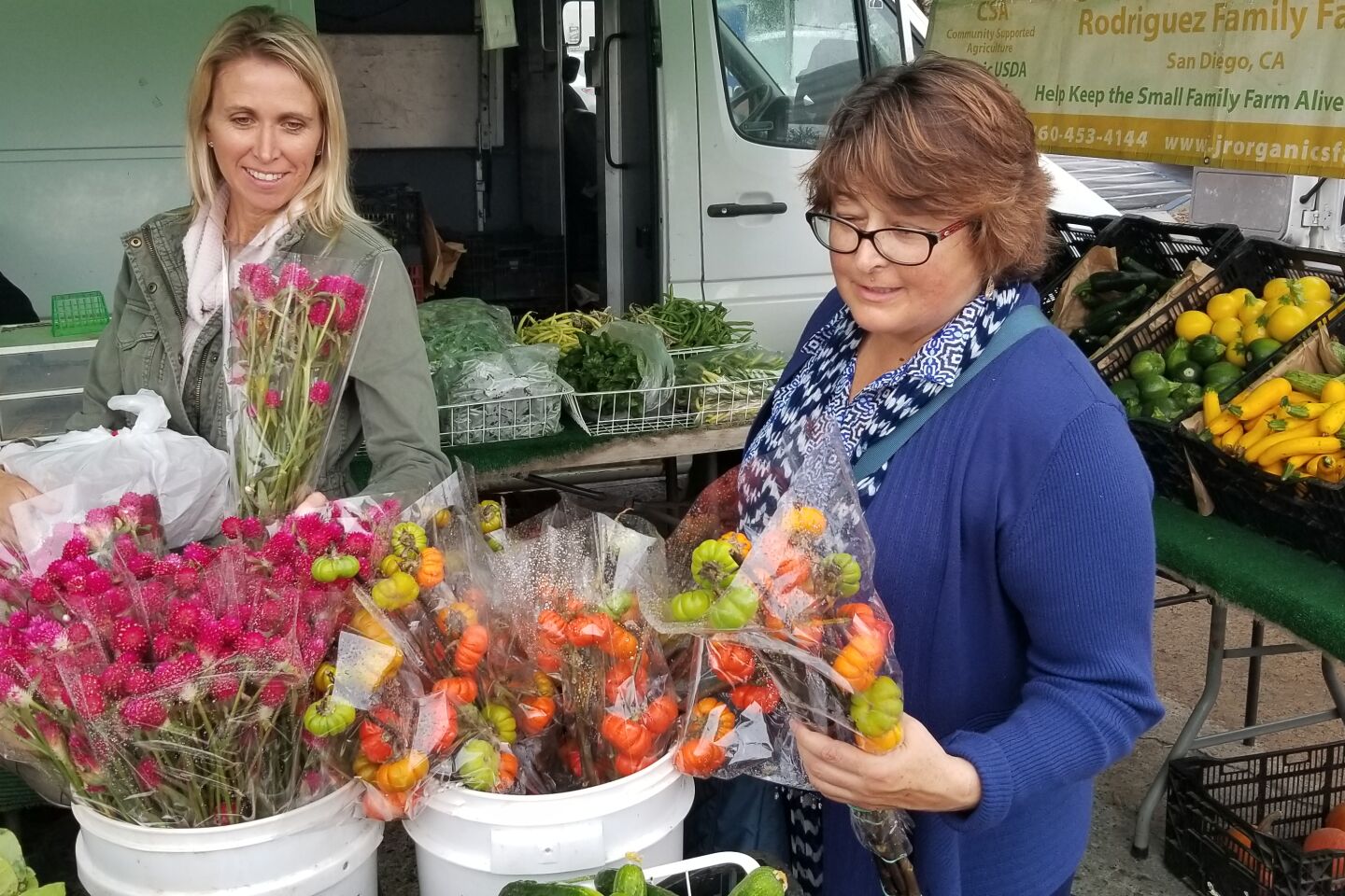 Katie Hadley and Paula Lorigan select fresh-cut flowers.