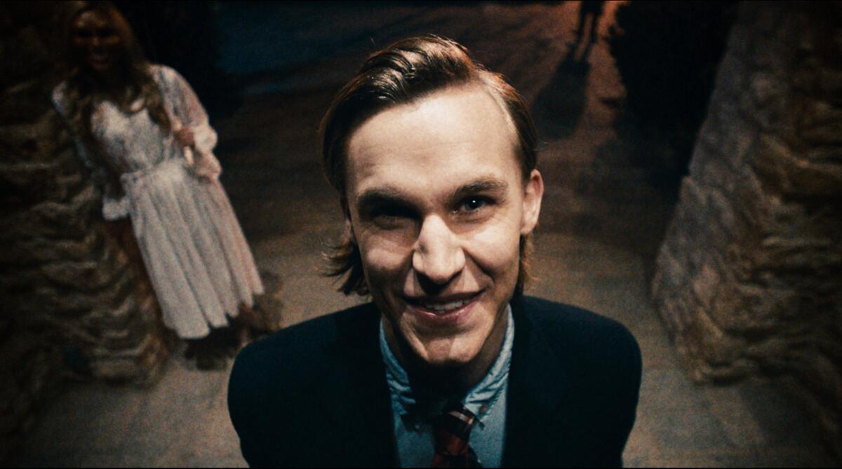 This film image released by Universal Pictures shows Tom Oller in a scene from "The Purge."