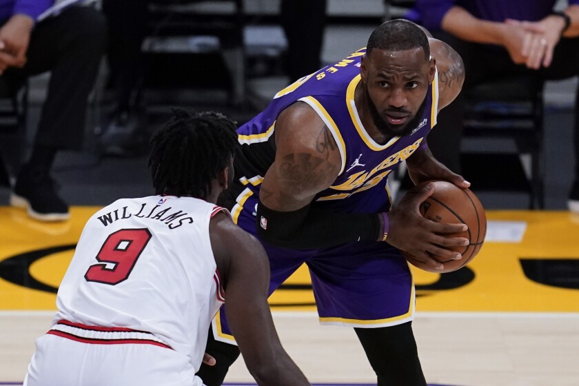 Lakers forward LeBron James looks past Chicago Bulls forward Patrick Williams.