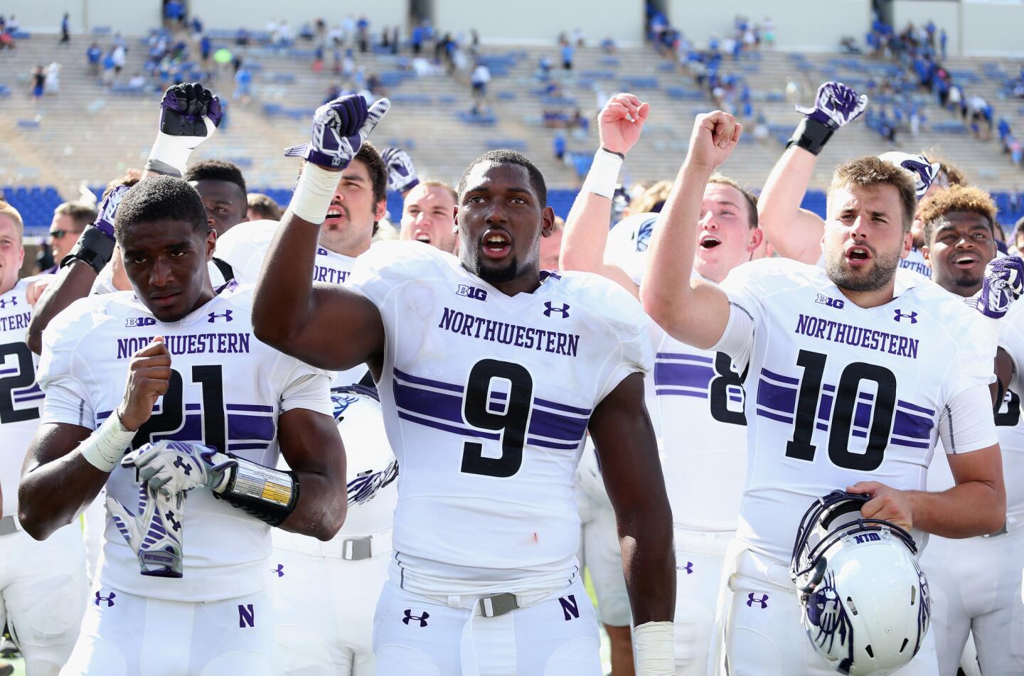 The Northwestern Wildcats celebrate after defeating the Duke Blue Devils 19-10.