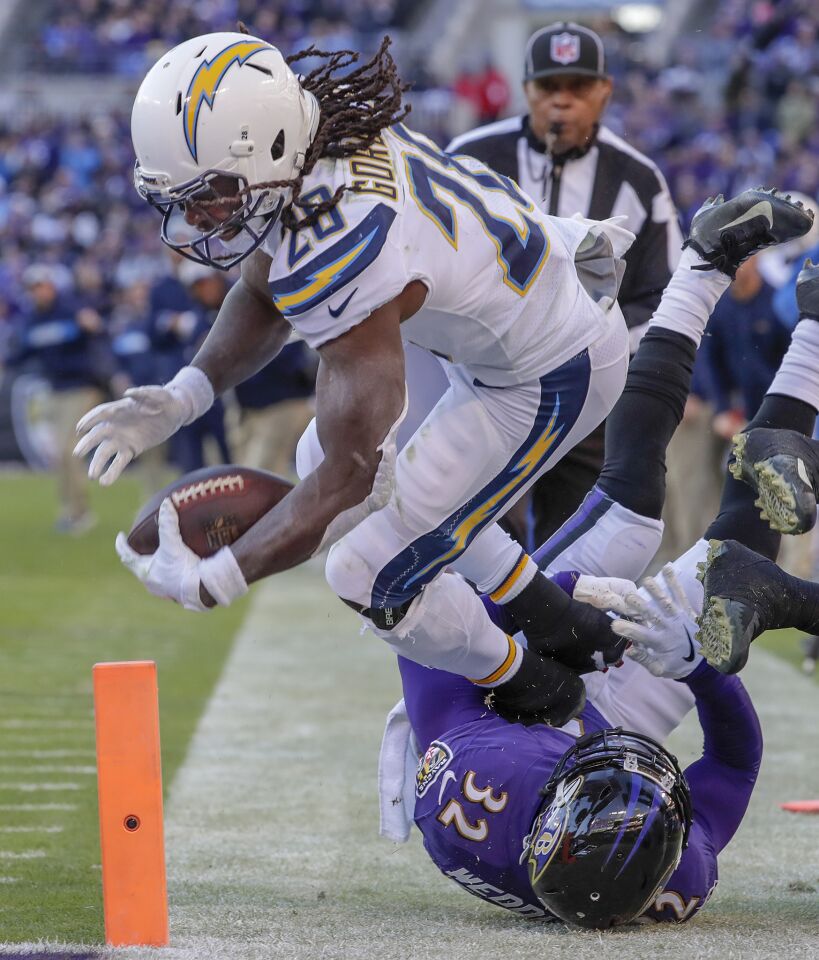 Chargers running back Melvin Gordon comes up a little short of the goal line as he is tackled by Ravens safety Eric Weddle late in the third quarter.