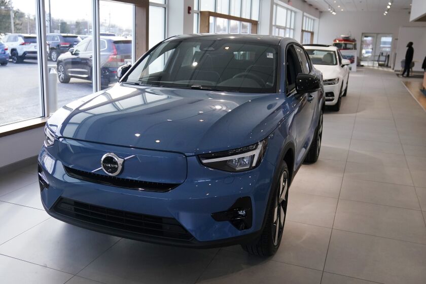 A 2023 Volvo C40 electric vehicle is displayed at a dealership, Tuesday, Feb. 7, 2023, in Exeter, N.H. Leasing is starting to look like the cheapest way to get an electric vehicle, because the U.S. government is giving it a big advantage. Dealers can apply up to the full $7,500 U.S. tax credit to leases of all electric vehicles regardless of where they're made.(AP Photo/Charles Krupa)