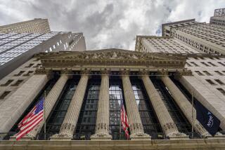 Storm clouds form above the New York Stock Exchange building in New York City, Tuesday, Aug. 8, 2023. Stocks are tumbling as worries about the banking system and the global economy inject more caution into financial markets worldwide. (AP Photo/J. David Ake)
