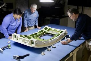 NTSB investigators examine the door plug from Alaska Airlines flight 1282, a Boeing 737-9 MAX.