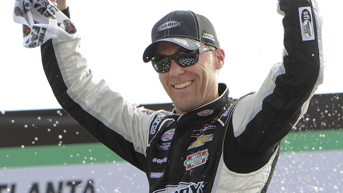 Kevin Harvick celebrates after winning Saturday's NASCAR Xfinity Series race at Atlanta Motor Speedway.