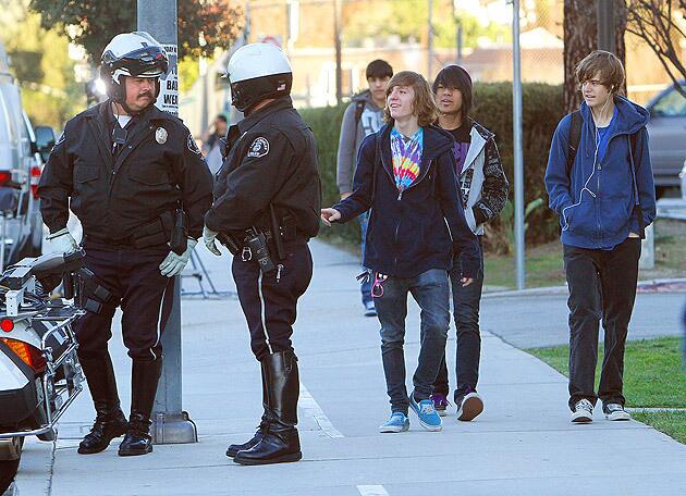 As students return to school at El Camino Real High School in Woodland Hills the day after a shooting near campus, L.A. Unified school police were out in force. See full story