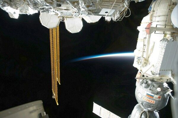 STS-133 space shuttle Discovery at the International Space Station