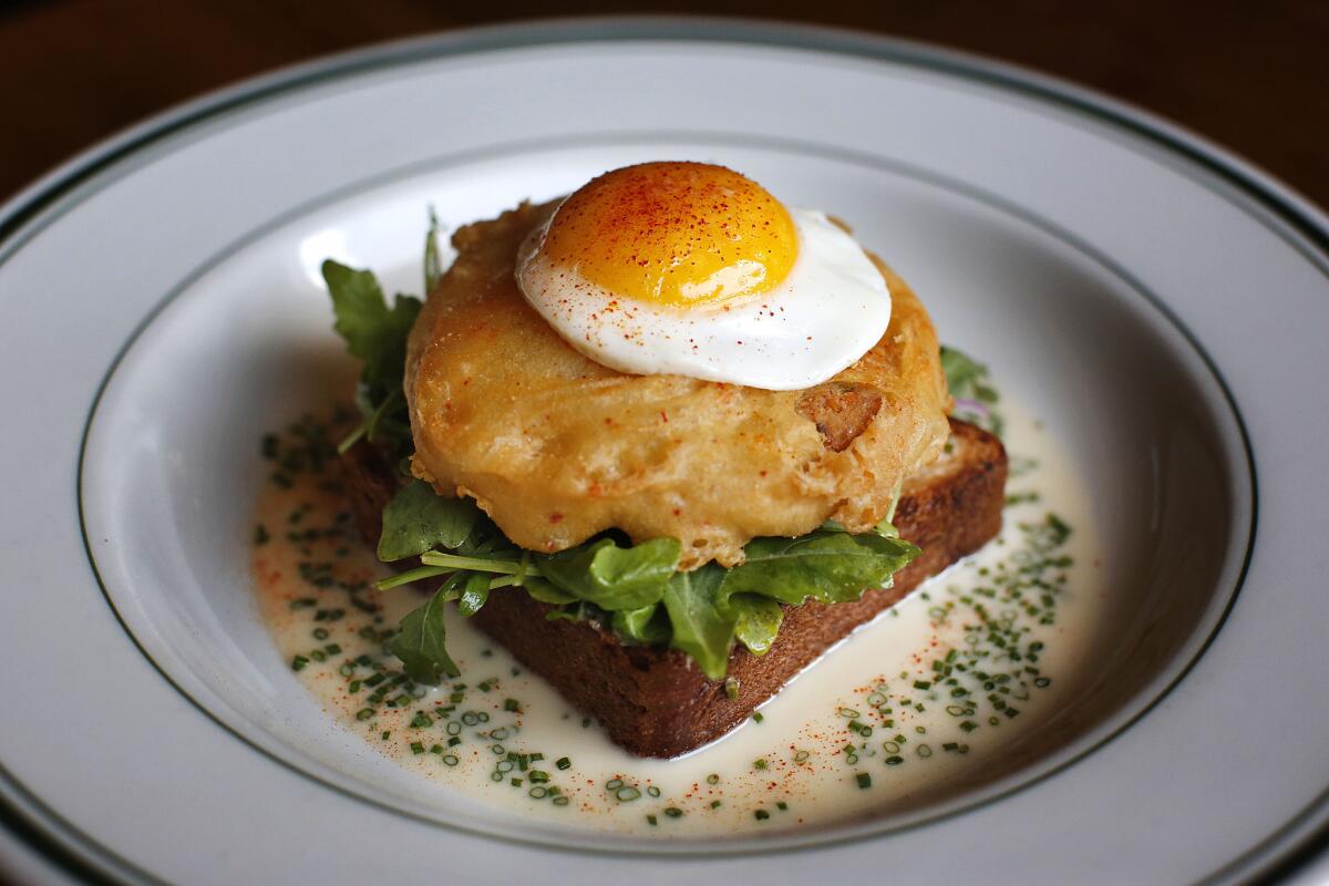 Open-faced crab cake sandwich served for brunch at Connie & Ted's restaurant in West Hollywood.