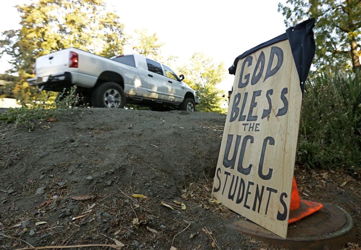 A sign honoring those killed in a fatal shooting at Umpqua Community College, is displayed Friday, Oct. 2, in Roseburg, Oregon.