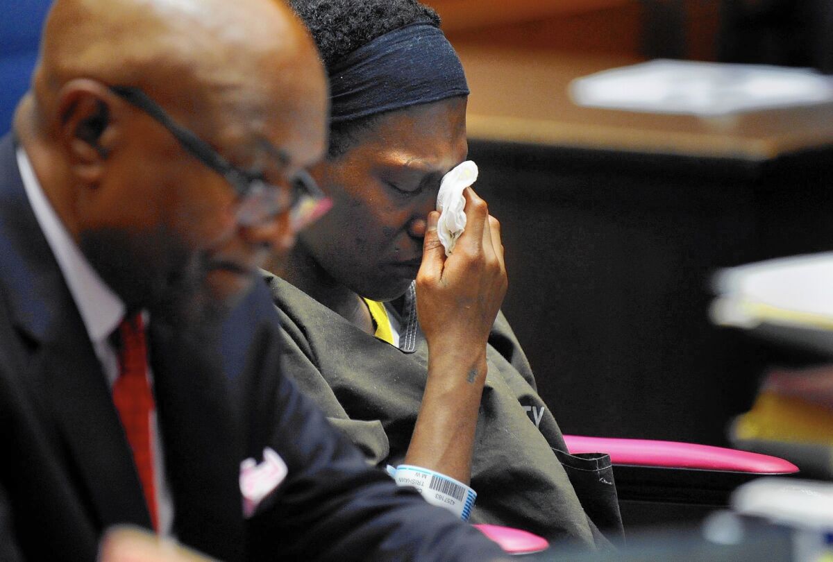 Trishawn Cardessa Carey wipes her eyes during her bail hearing in downtown Los Angeles.