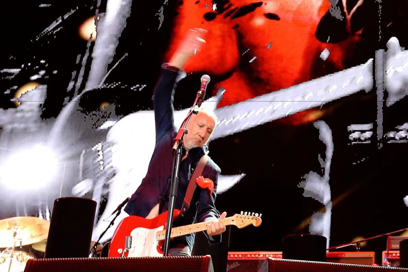 Pete Townsend strums in his trademark windmill style while performing with the Who during weekend 2 of Desert Trip in Indio on Sunday.