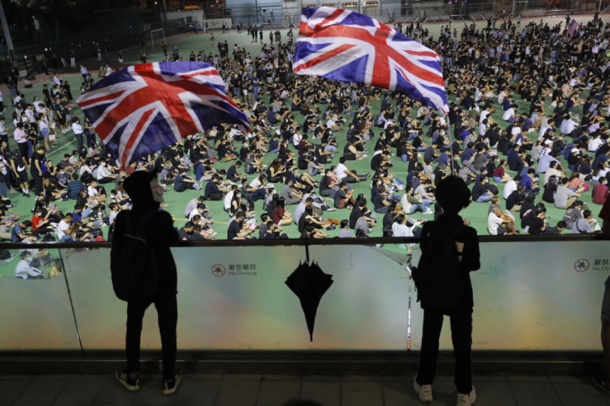 People in Hong Kong rally Oct. 2 in support of a wounded protester.