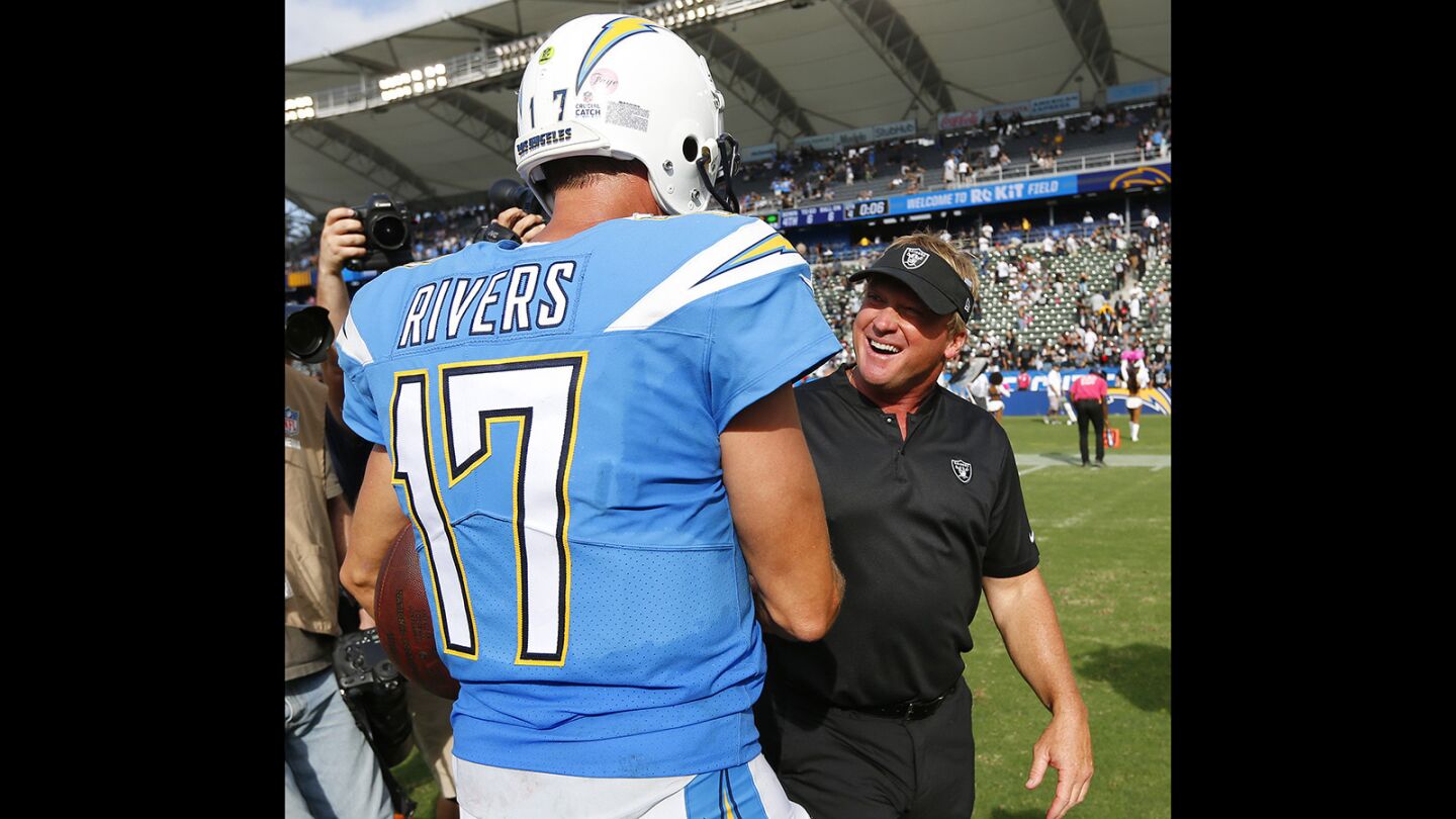 Los Angeles Chargers quarterback Philip Rivers talks with Oakland Raiders coach Jon Gruden after the game at the StubHub Center in Carson on Oct. 7, 2018. (Photo by K.C. Alfred/San Diego Union-Tribune)