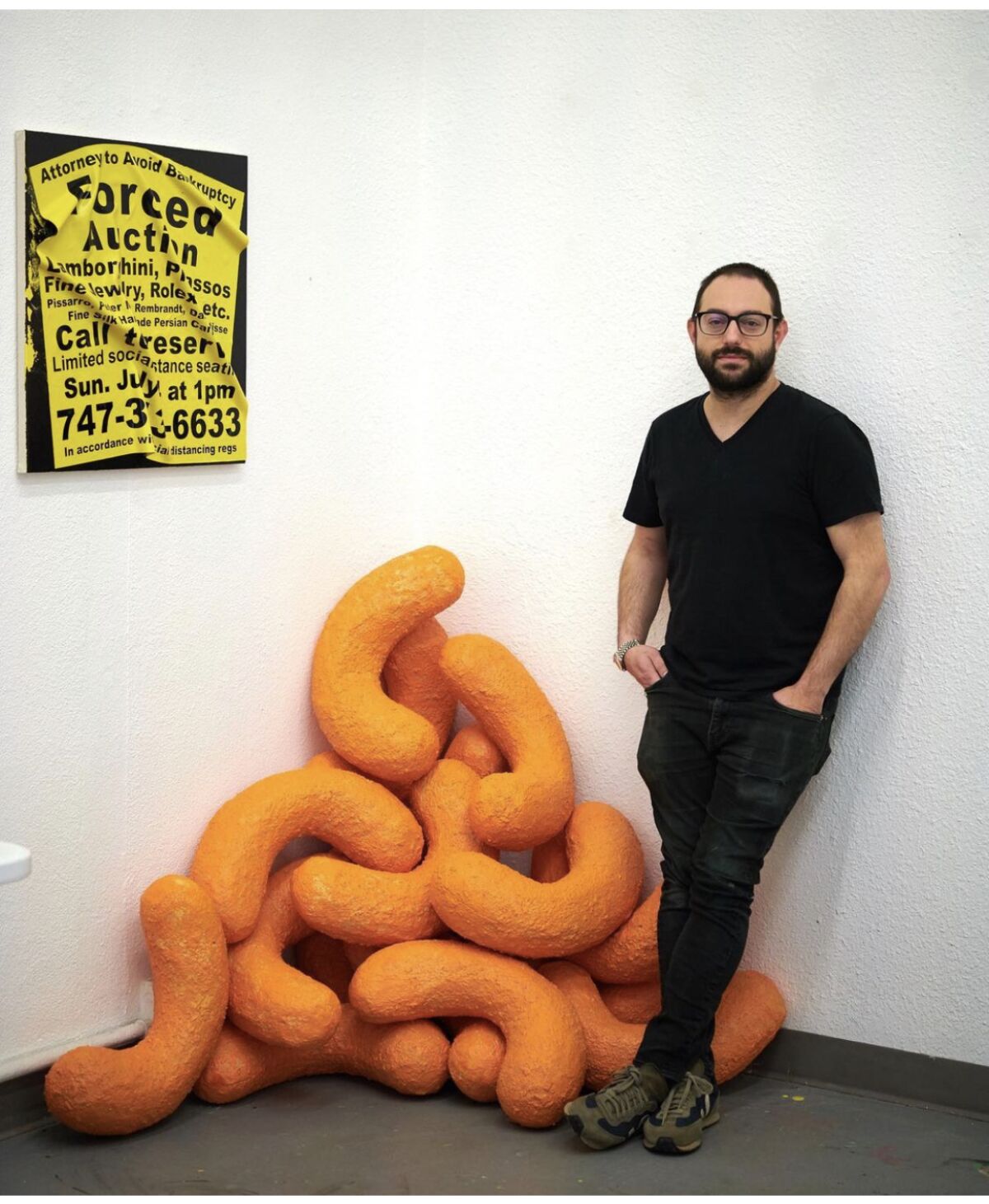 Artist Sam Keller with his Cheeto sculpture.