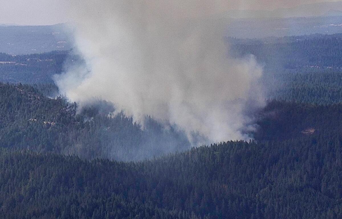 Smoke rises from a wildfire northeast of Placerville.