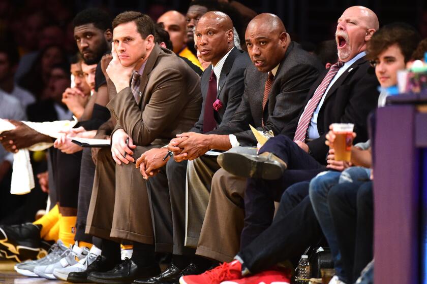 Lakers Coach Byron Scott and members of his coaching staff look on from the bench during a game against the Grizzlies on Feb. 26.