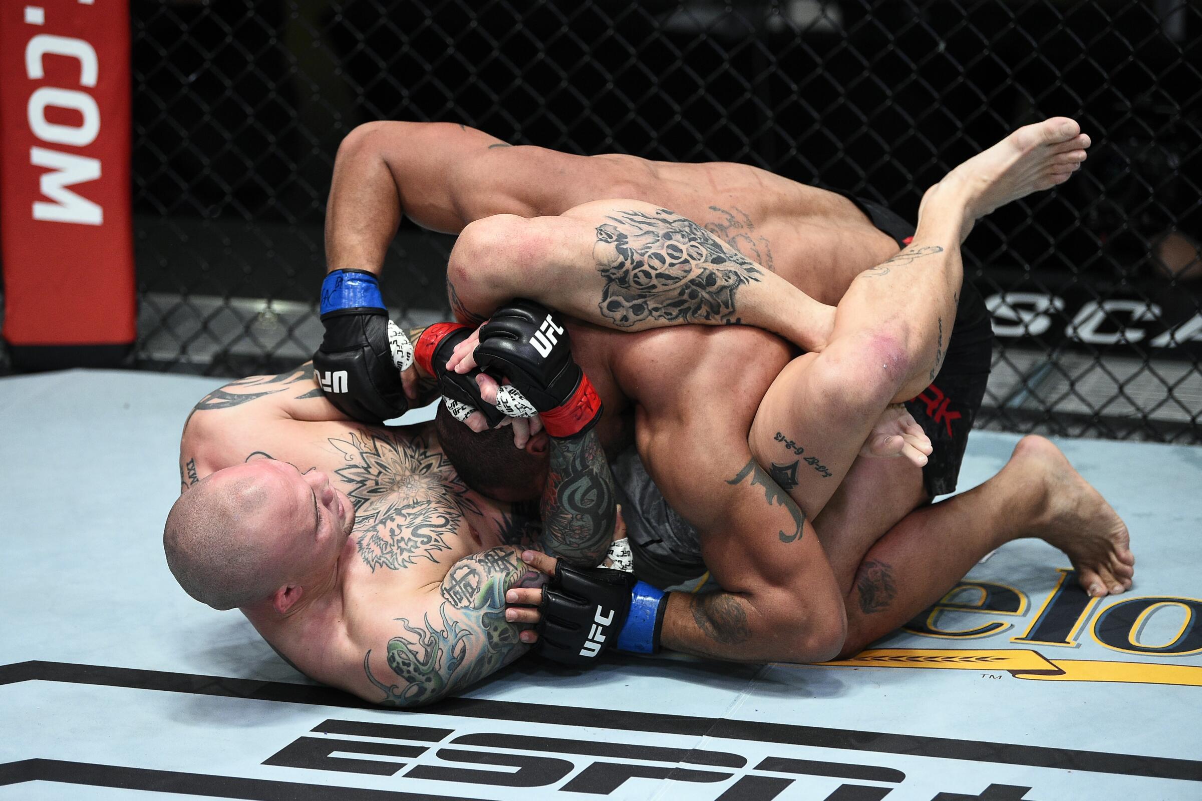 Anthony Smith attempts to submit Devin Clark in their light heavyweight bout during UFC Fight Night at UFC APEX.