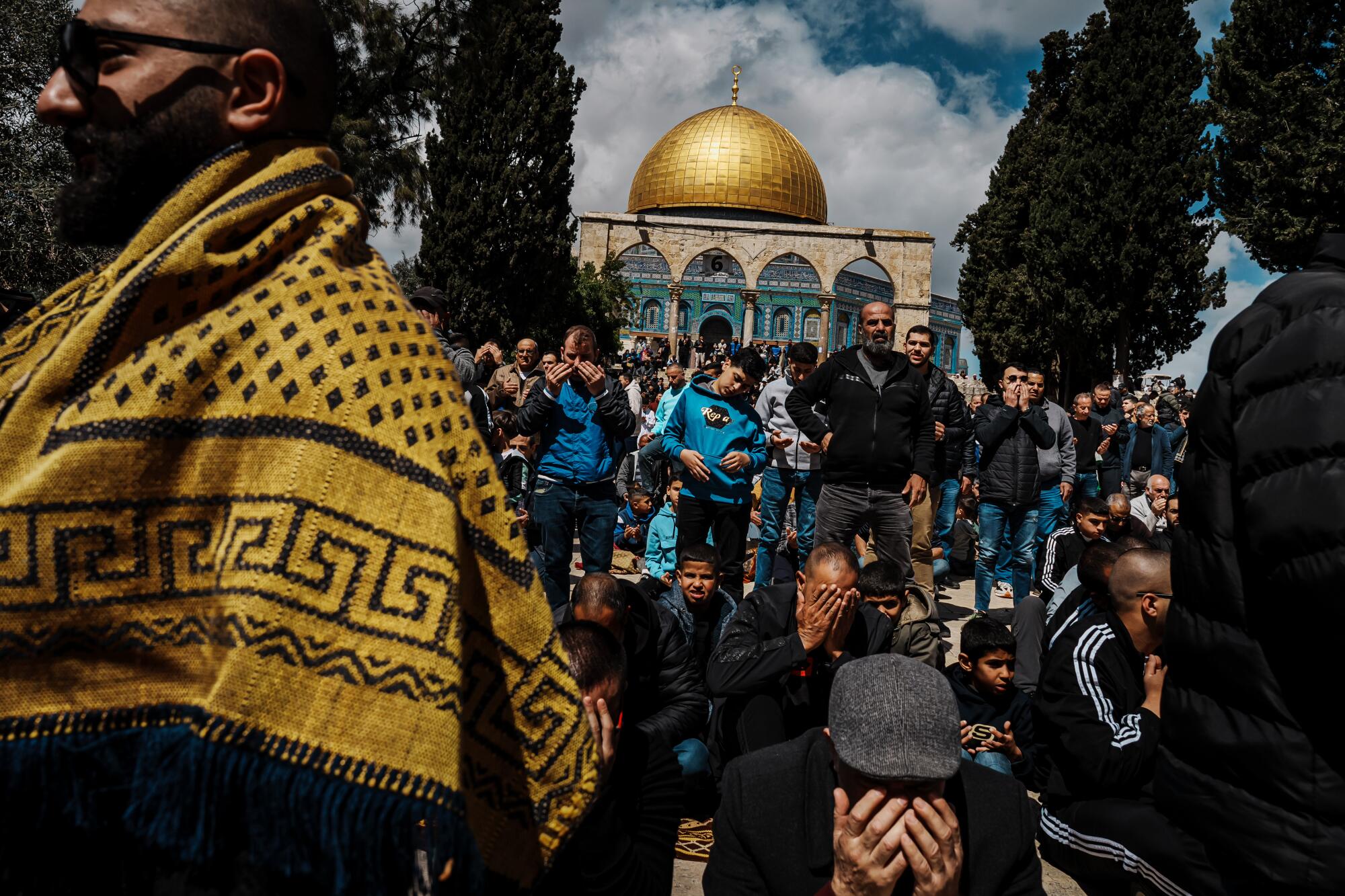 Worshipers listen to a sermon during noon prayers in the Al Aqsa Mosque.