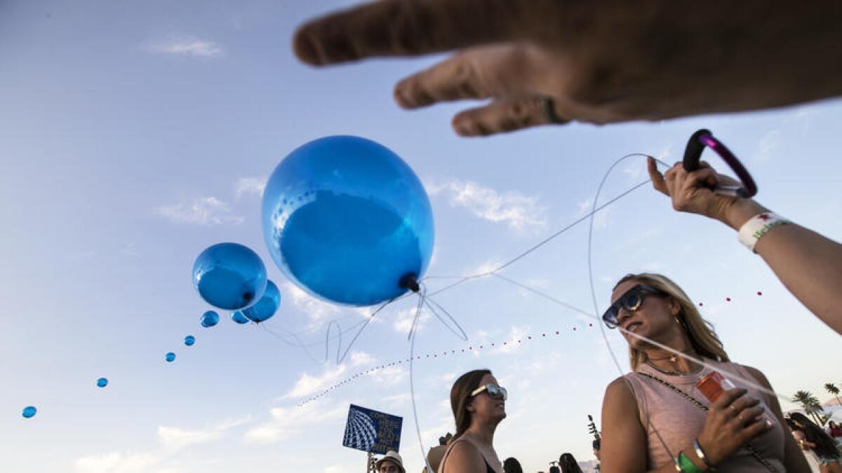 Balloons are sent aloft at sunset at the Coachella Music and Arts Festival in Indio on Saturday.