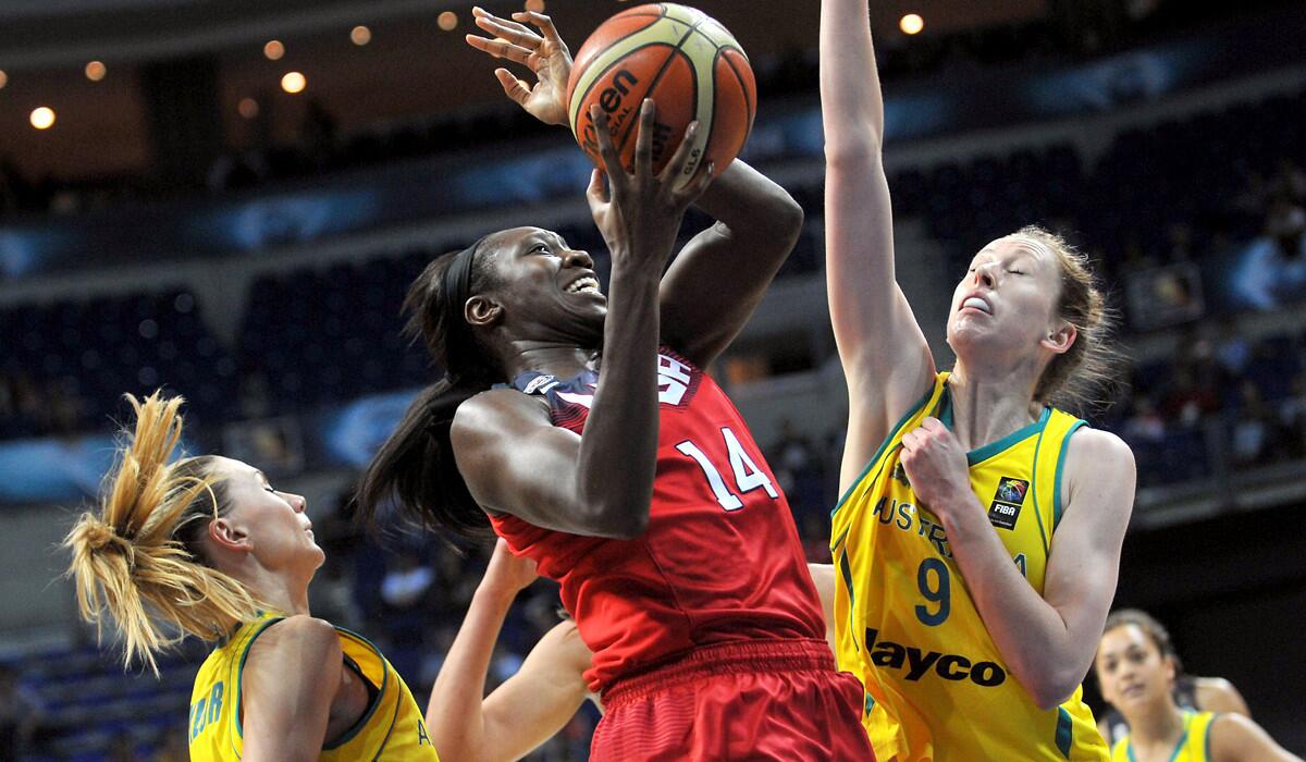 U.S. center Tina Charles (14) tries to score against Australia's Penny Taylor, left, and Natalie Burton in the semifinals of the world championships on Saturday in Istanbul.