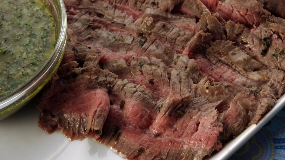 Grilled flank steak with chimichurri sauce makes for an easy, affordable dinner idea.