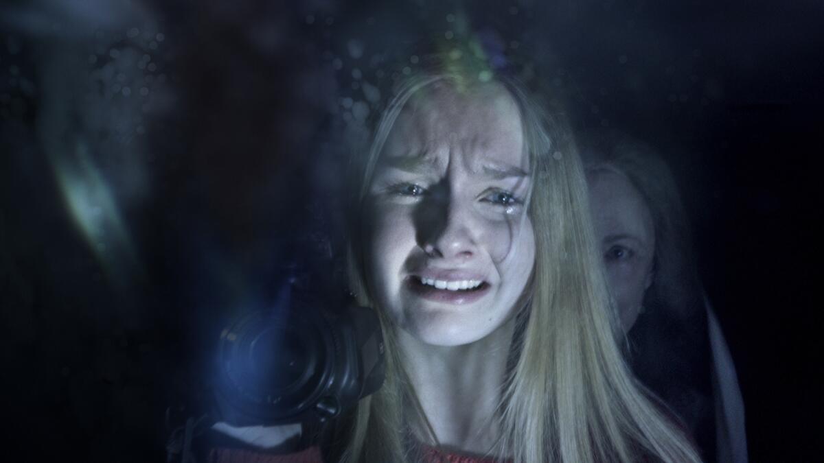 Olivia DeJonge, foreground, and Deanna Dunagan star in M. Night Shyamalan's hoped-for comeback "The Visit."