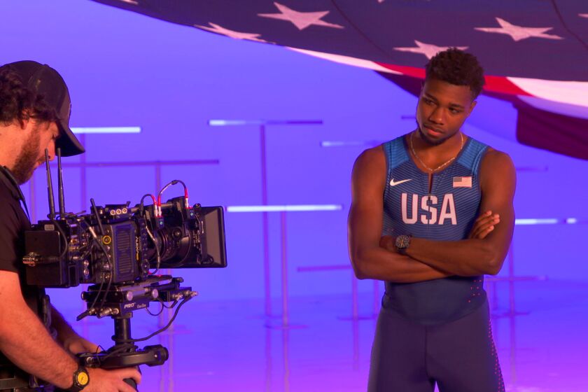 Noah Lyles on "flag" soundstage. NBCUniversal recently summoned 110 U.S. athletes to a West Hollywood studio, shepherding them through soundstages, photo shoots and recording booths, taping interviews for use during the Games and, just as important, gathering raw material for ads and promos right now.