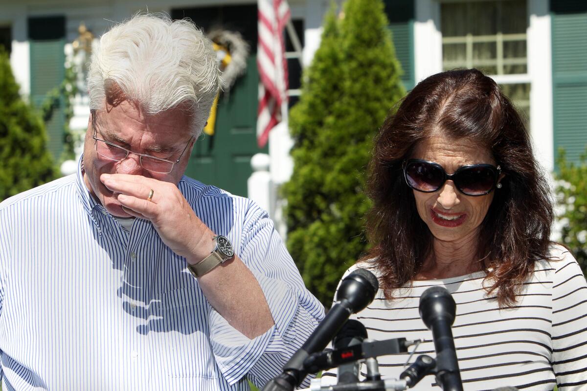 John and Diane Foley talk to reporters outside their home in Rochester, N.H., after speaking with President Obama on Wednesday. Their son James Foley was abducted in November 2012 while covering the Syrian conflict.